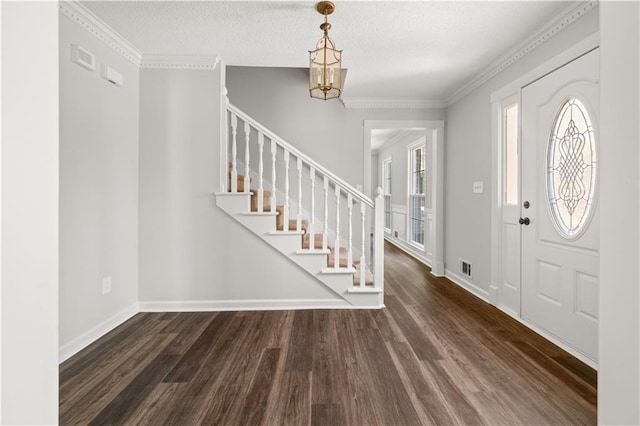 5659 Brookstone Dr NW, Acworth, GA 30101 - entrance foyer with wood finished floors, stairway, a chandelier, baseboards, and crown molding