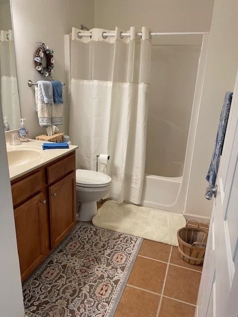 full bathroom with tile patterned flooring, vanity, shower / bath combination with curtain, and toilet