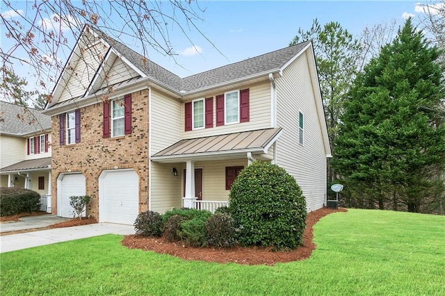 view of front facade with a front lawn, concrete driveway, covered porch, an attached garage, and a standing seam roof