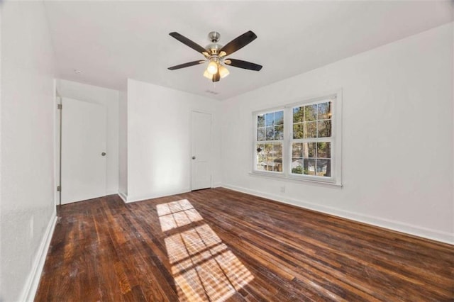 unfurnished room featuring hardwood / wood-style flooring, baseboards, and ceiling fan