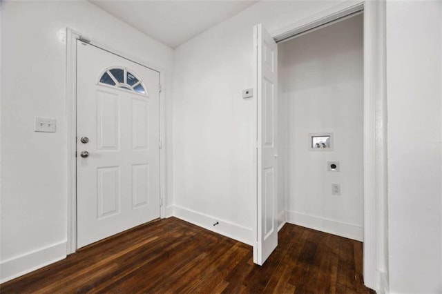 entryway featuring dark wood finished floors and baseboards