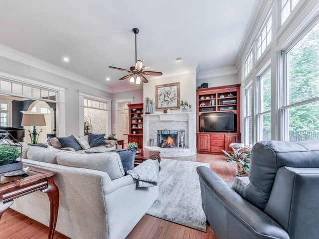 275 Frances Rd, Canton, GA 30114 - living room with wood-type flooring, a brick fireplace, ceiling fan, crown molding, and recessed lighting