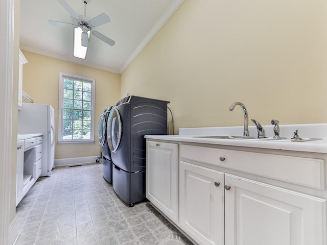 275 Frances Rd, Canton, GA 30114 - laundry area with cabinet space, ornamental molding, ceiling fan, baseboards, and washer / clothes dryer