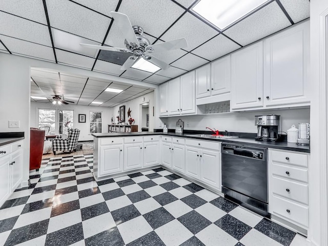 275 Frances Rd, Canton, GA 30114 - kitchen with black dishwasher, ceiling fan, a sink, a peninsula, and a drop ceiling