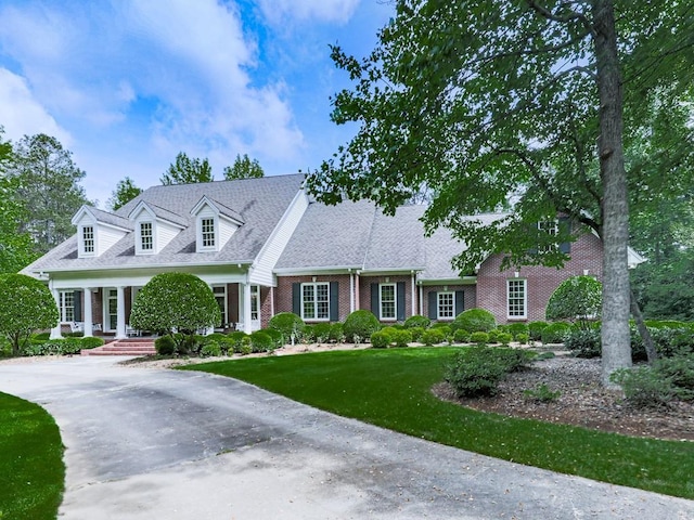 275 Frances Rd, Canton, GA 30114 - cape cod house featuring brick siding, a front lawn, and a shingled roof