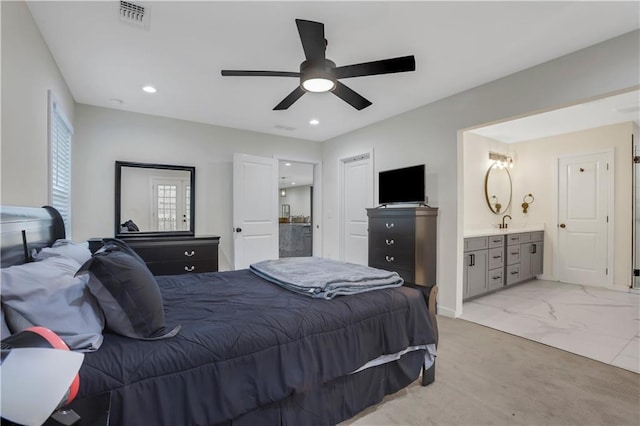 bedroom with connected bathroom, sink, and ceiling fan