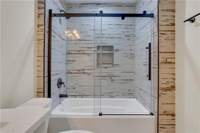 full bathroom with vanity, shower / bath combination with glass door, and toilet