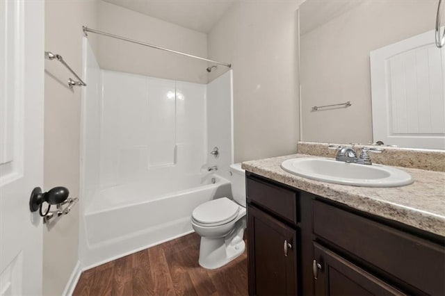 full bathroom featuring bathtub / shower combination, toilet, vanity, and wood-type flooring