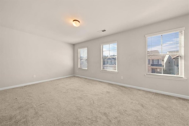 spare room featuring carpet floors