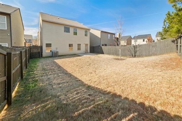 back of house featuring central AC