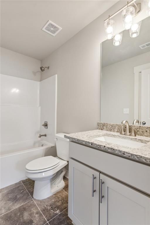 4045 Links Blvd, Jefferson, GA 30549 - full bathroom featuring vanity, toilet, shower / bath combination, and tile patterned flooring