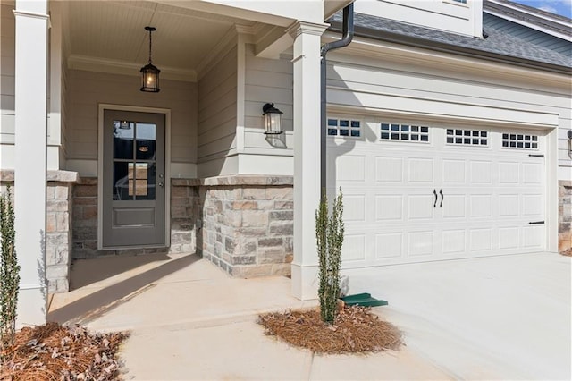 4045 Links Blvd, Jefferson, GA 30549 - entrance to property featuring a garage, stone siding, driveway, and a porch
