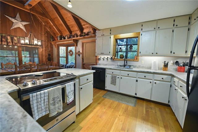 kitchen featuring lofted ceiling with beams, black dishwasher, a notable chandelier, light hardwood / wood-style flooring, and stainless steel electric stove