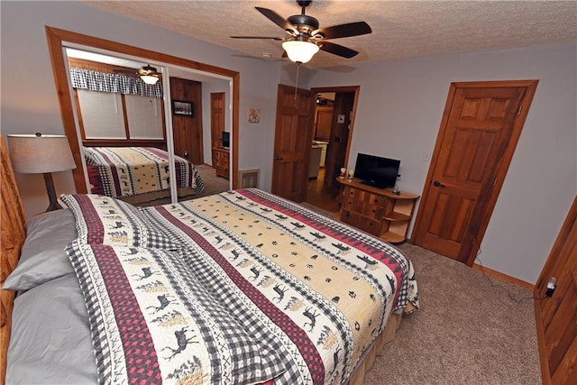 bedroom featuring a textured ceiling, ceiling fan, and carpet floors