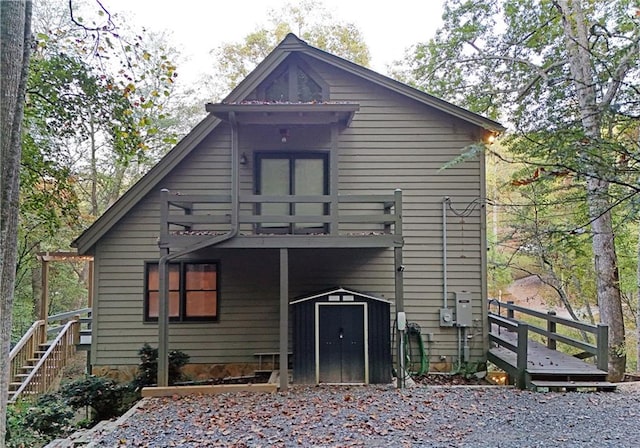 back of property featuring a deck