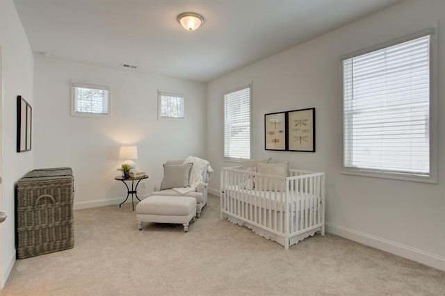 bedroom featuring visible vents, baseboards, and carpet flooring