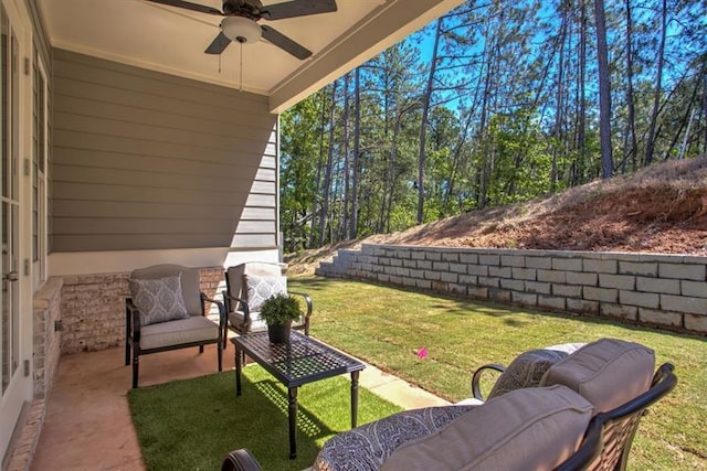 view of patio featuring outdoor lounge area and a ceiling fan