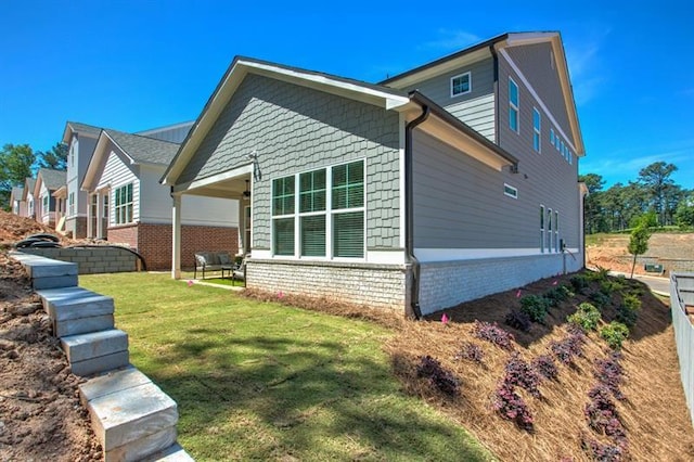 view of property exterior with a yard