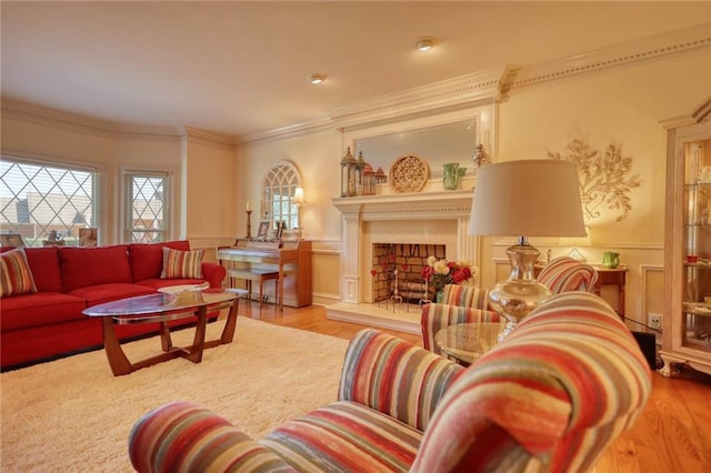 living room with light hardwood / wood-style flooring and crown molding