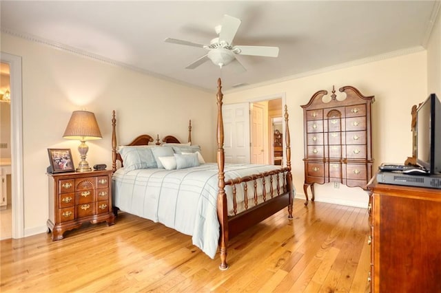 bedroom featuring ensuite bath, ceiling fan, crown molding, and wood-type flooring