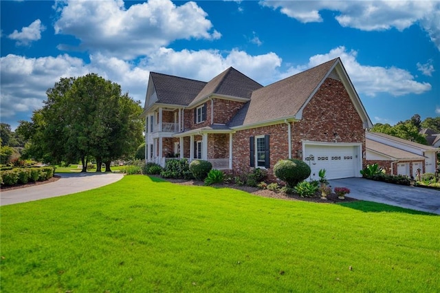 view of front of house featuring a garage and a front lawn