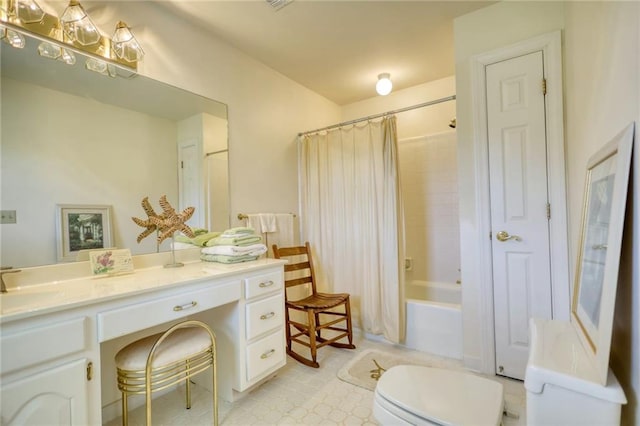 full bathroom with shower / tub combo with curtain, vanity, and toilet