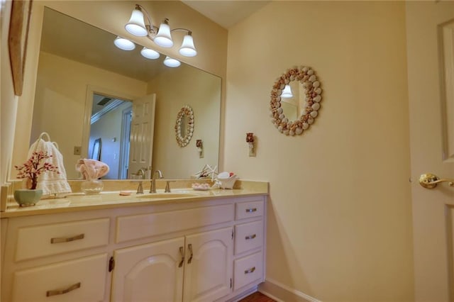 bathroom with vanity and an inviting chandelier