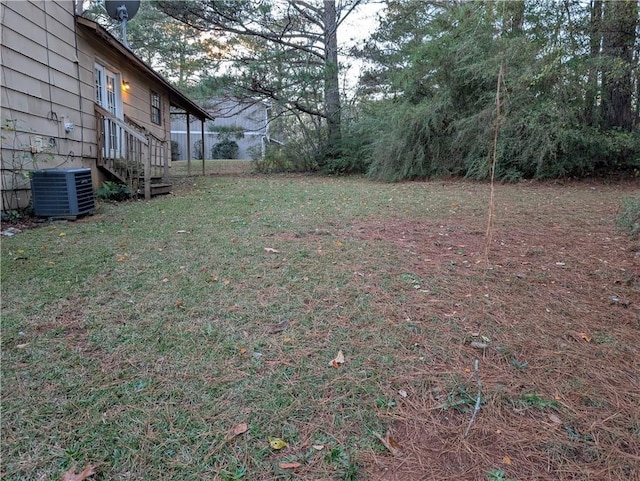 view of yard featuring central air condition unit