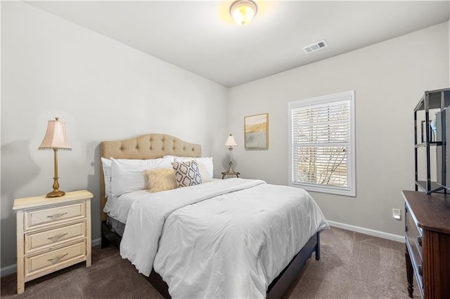 bedroom featuring visible vents, baseboards, and dark colored carpet