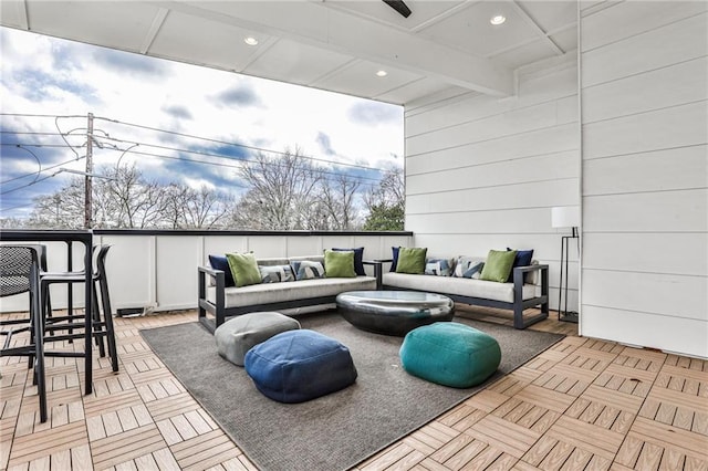 view of patio / terrace featuring an outdoor living space and ceiling fan