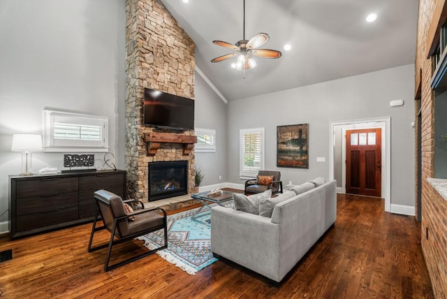 living room with ceiling fan, high vaulted ceiling, a fireplace, and dark hardwood / wood-style floors