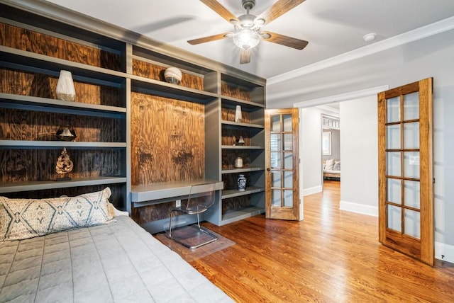 bedroom with french doors, hardwood / wood-style flooring, and ceiling fan