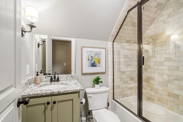 full bathroom featuring toilet, lofted ceiling, enclosed tub / shower combo, and vanity