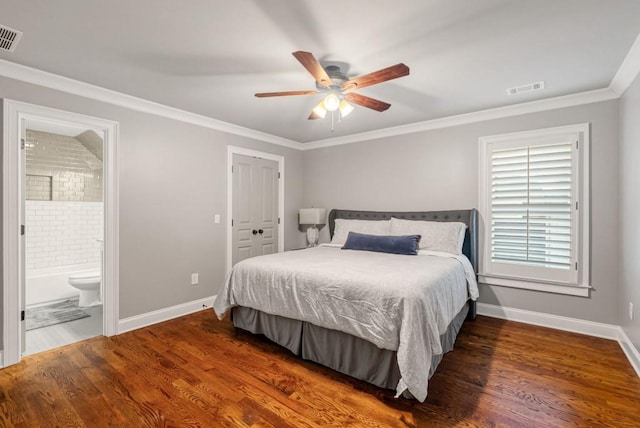 bedroom with ornamental molding, dark wood-type flooring, connected bathroom, and ceiling fan