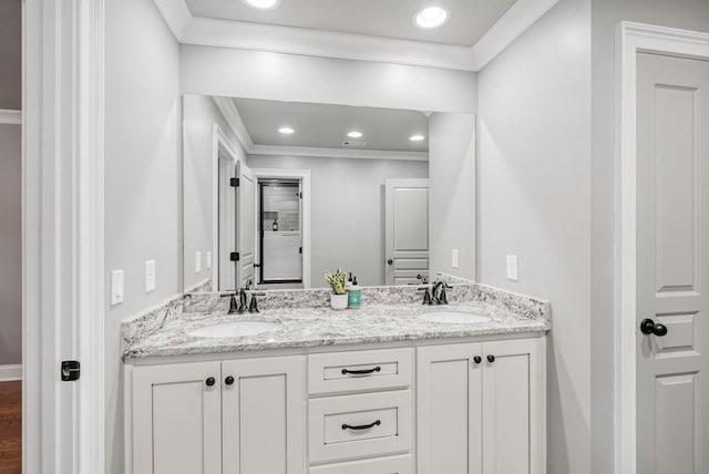 bathroom with vanity and crown molding