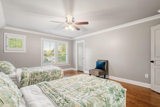 bedroom with crown molding, dark wood-type flooring, vaulted ceiling, and ceiling fan