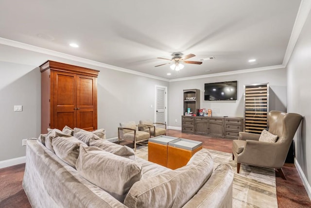 living room with ceiling fan and ornamental molding