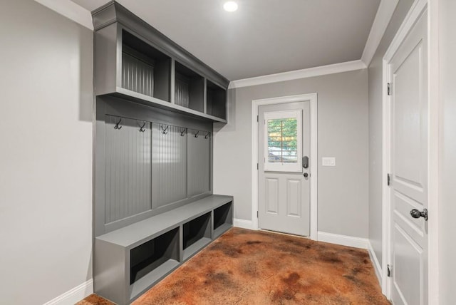 mudroom featuring dark carpet and ornamental molding