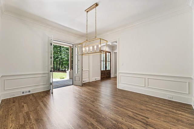 1960 Drummond Pond Rd, Milton, GA 30004 - unfurnished dining area featuring a chandelier, wood finished floors, crown molding, a decorative wall, and a wainscoted wall