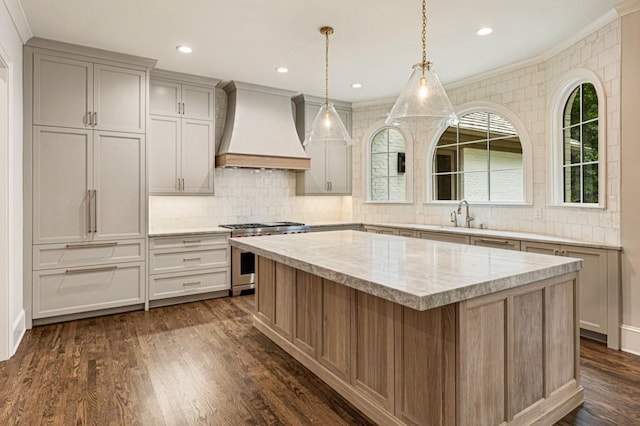 1960 Drummond Pond Rd, Milton, GA 30004 - kitchen with custom range hood, high end stainless steel range, a center island, backsplash, and dark wood-type flooring