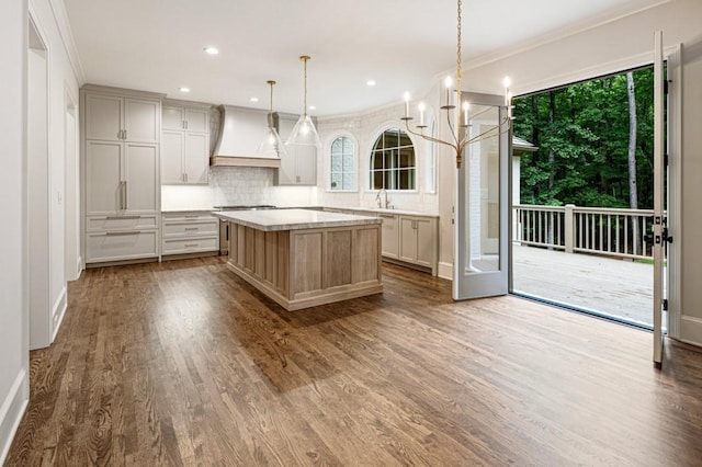 1960 Drummond Pond Rd, Milton, GA 30004 - kitchen featuring custom range hood, tasteful backsplash, dark wood-type flooring, a kitchen island, and light countertops