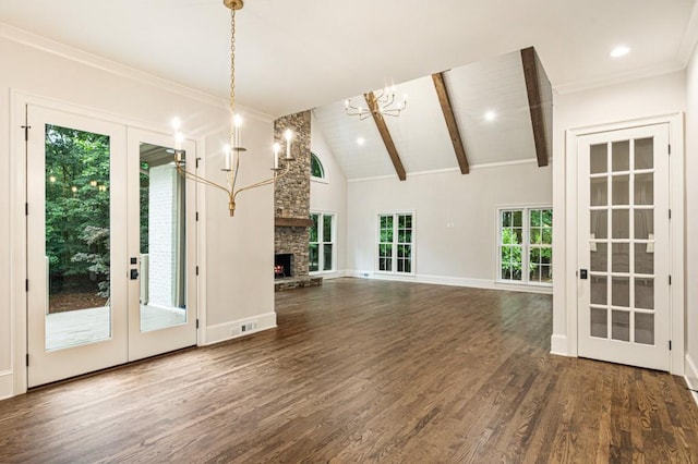 1960 Drummond Pond Rd, Milton, GA 30004 - unfurnished living room featuring french doors, a chandelier, wood finished floors, beamed ceiling, and a stone fireplace
