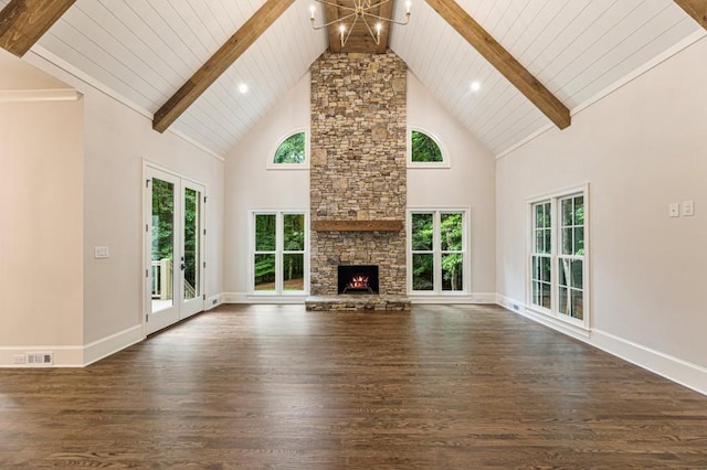1960 Drummond Pond Rd, Milton, GA 30004 - unfurnished living room with a chandelier, dark wood-style floors, high vaulted ceiling, a stone fireplace, and a wood ceiling with exposed beams