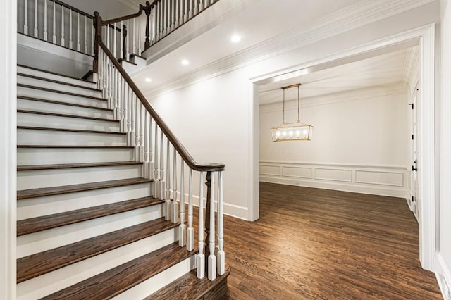 1960 Drummond Pond Rd, Milton, GA 30004 - stairway featuring ornamental molding, wood finished floors, a chandelier, a wainscoted wall, and a decorative wall