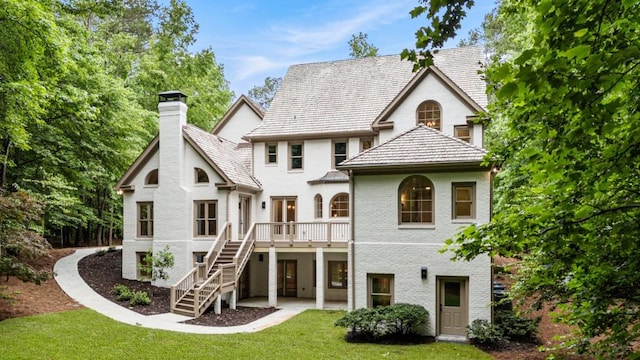 1960 Drummond Pond Rd, Milton, GA 30004 - back of house with a chimney, stairs, a lawn, brick siding, and a wooden deck