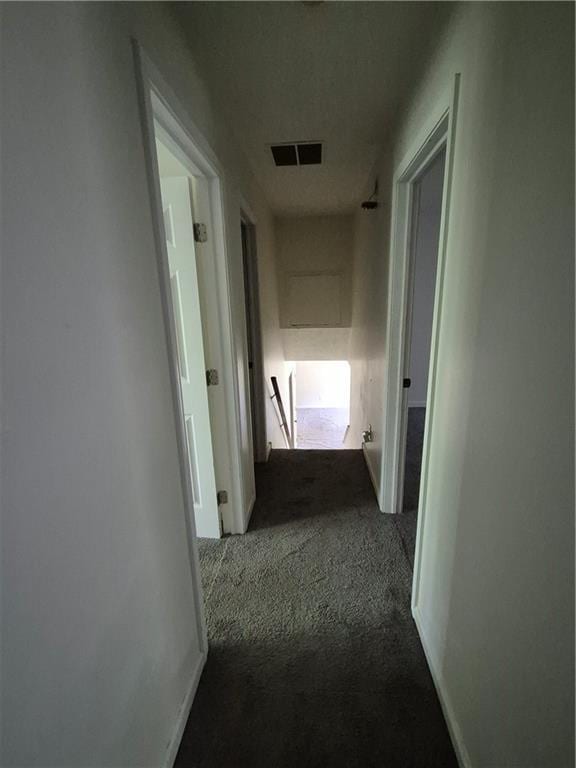 3832 Natalie Way, Ellenwood, GA 30294 - hall with dark colored carpet, an upstairs landing, and baseboards