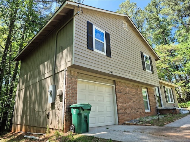 3832 Natalie Way, Ellenwood, GA 30294 - view of home's exterior with brick siding, a garage, and driveway