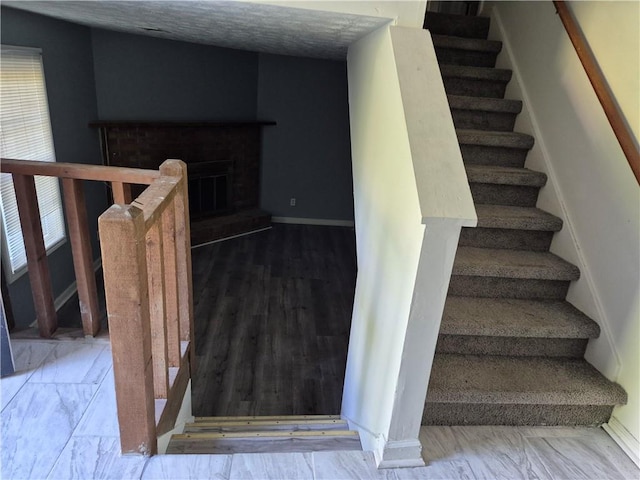 3832 Natalie Way, Ellenwood, GA 30294 - stairs with baseboards and a fireplace with raised hearth