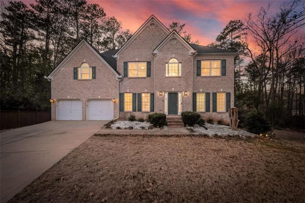 colonial inspired home with a garage