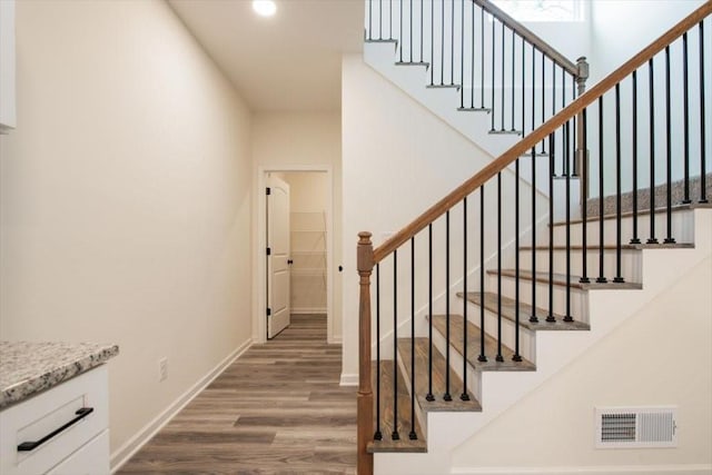 staircase featuring hardwood / wood-style floors